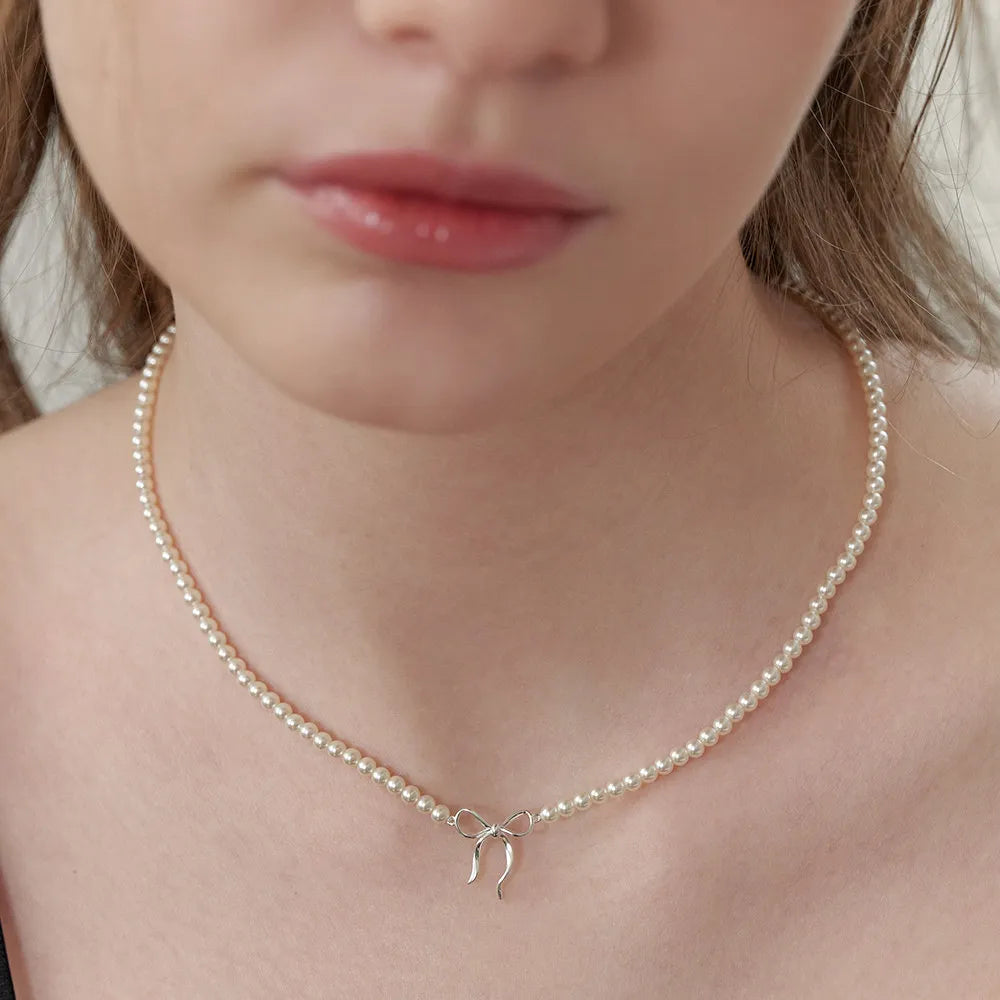 Collier nœud perles cuivrées