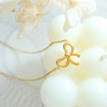 Collier avec nœud en plaqué or 18 carats