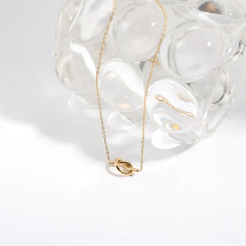 Collier noué plaqué or 18 carats