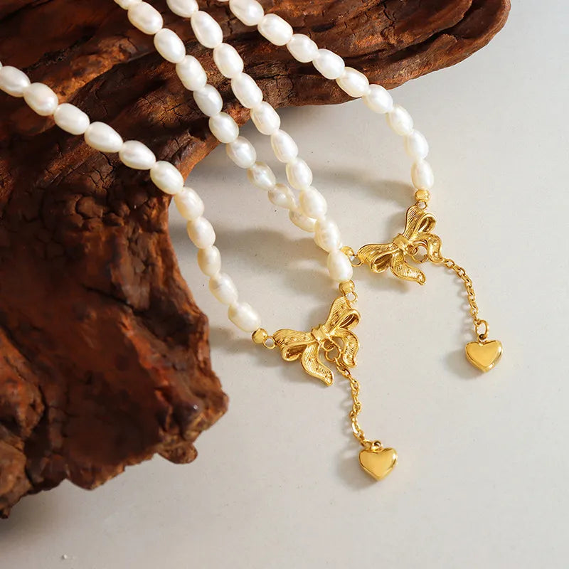 Collier cœur en acier titane et perles d'eau douce