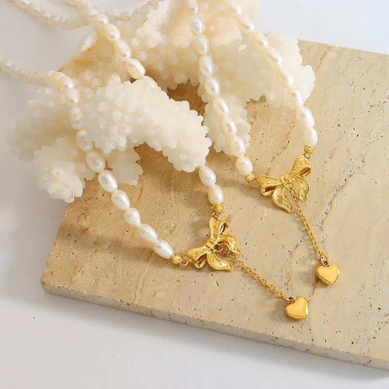 Collier cœur en acier titane et perles d'eau douce